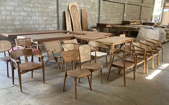 Various styles of teak chairs